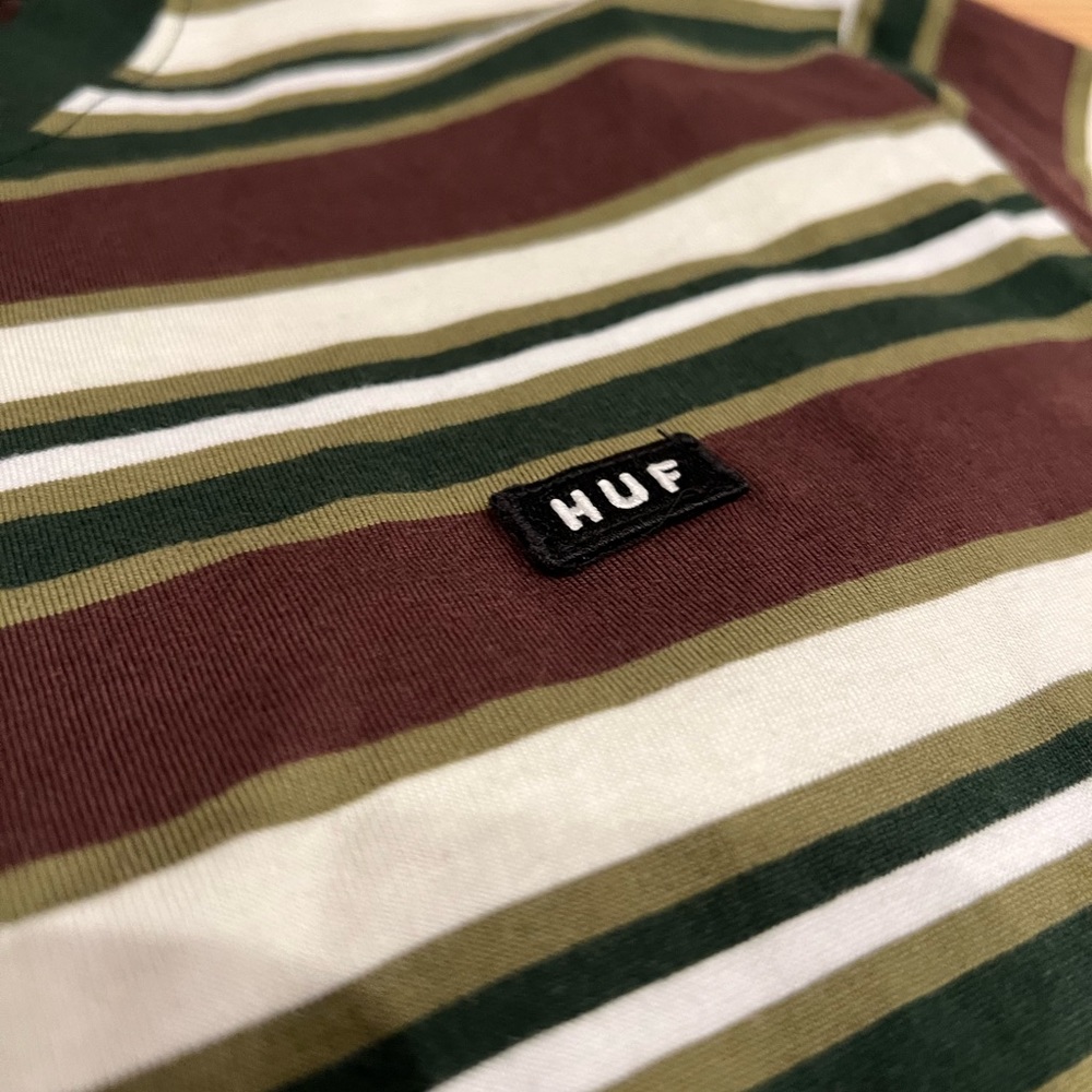Green, white, and brown striped t-shirt